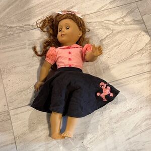 American Girl Doll with Pink Top and Black Skirt